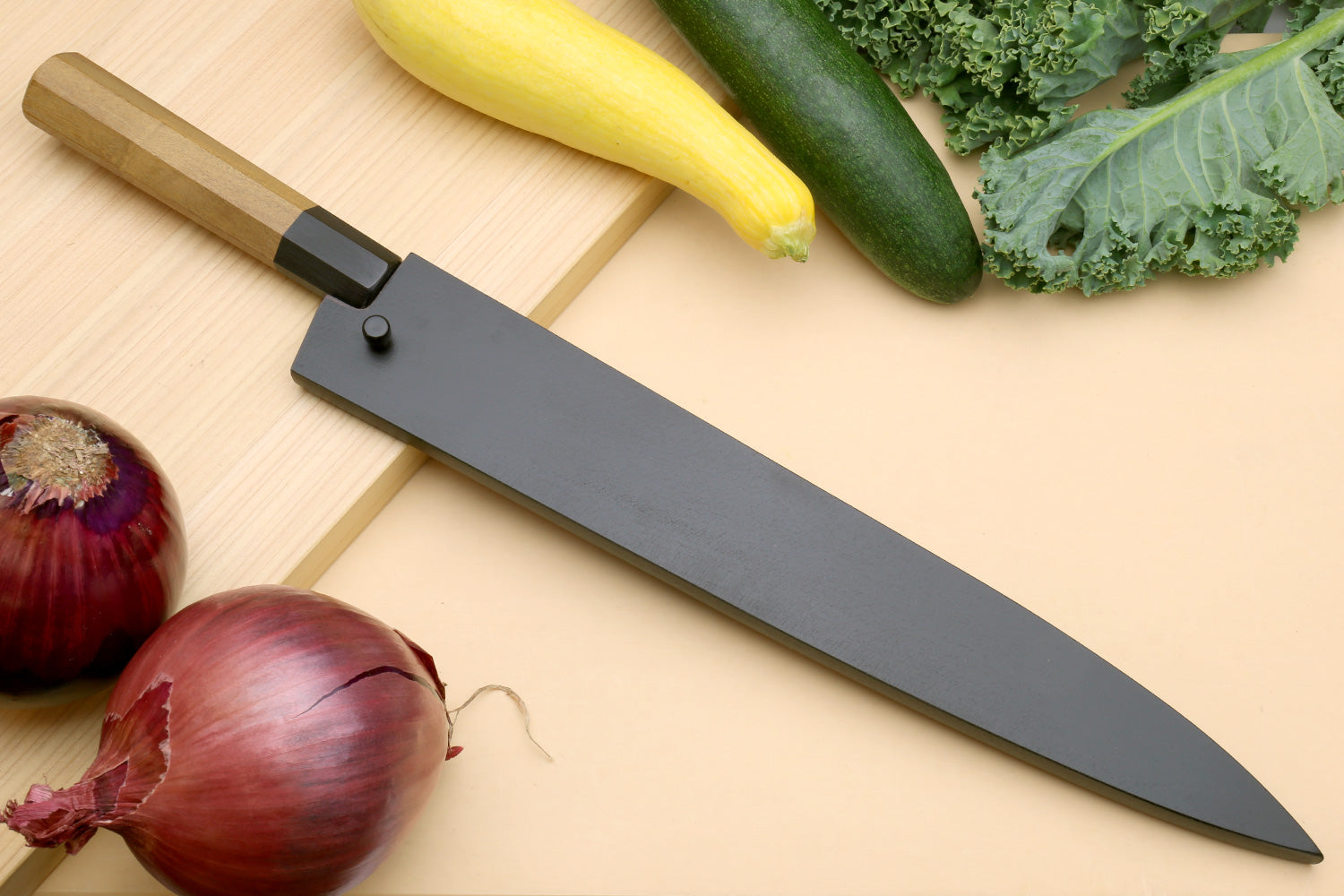 Japanese slicer knife with gray blade and wooden handle, black bolster and spacer
