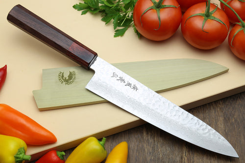 Japanese chef's knife with hammered Damascus blade and dark octagonal rosewood handle