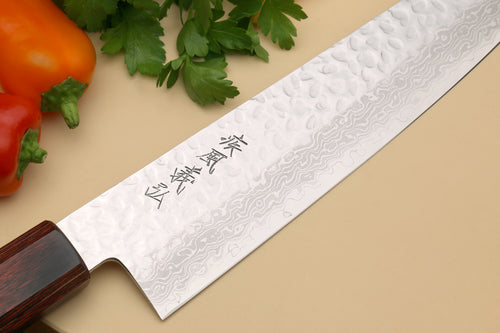 Japanese chef's knife blade close-up with hammered Damascus pattern and dark rosewood handle