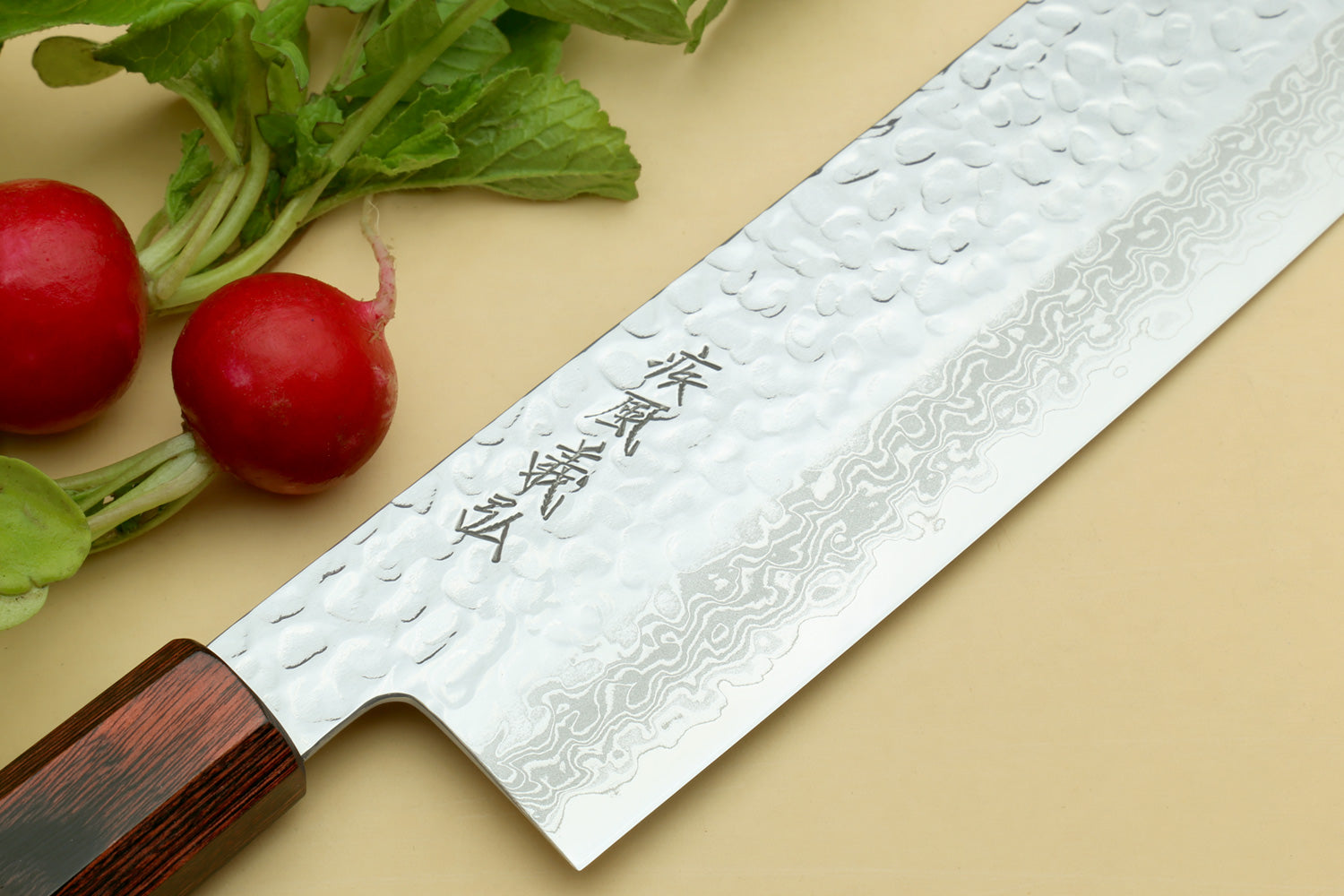 Nakiri vegetable knife featuring hammered Damascus blade with stamped markings and rosewood handle