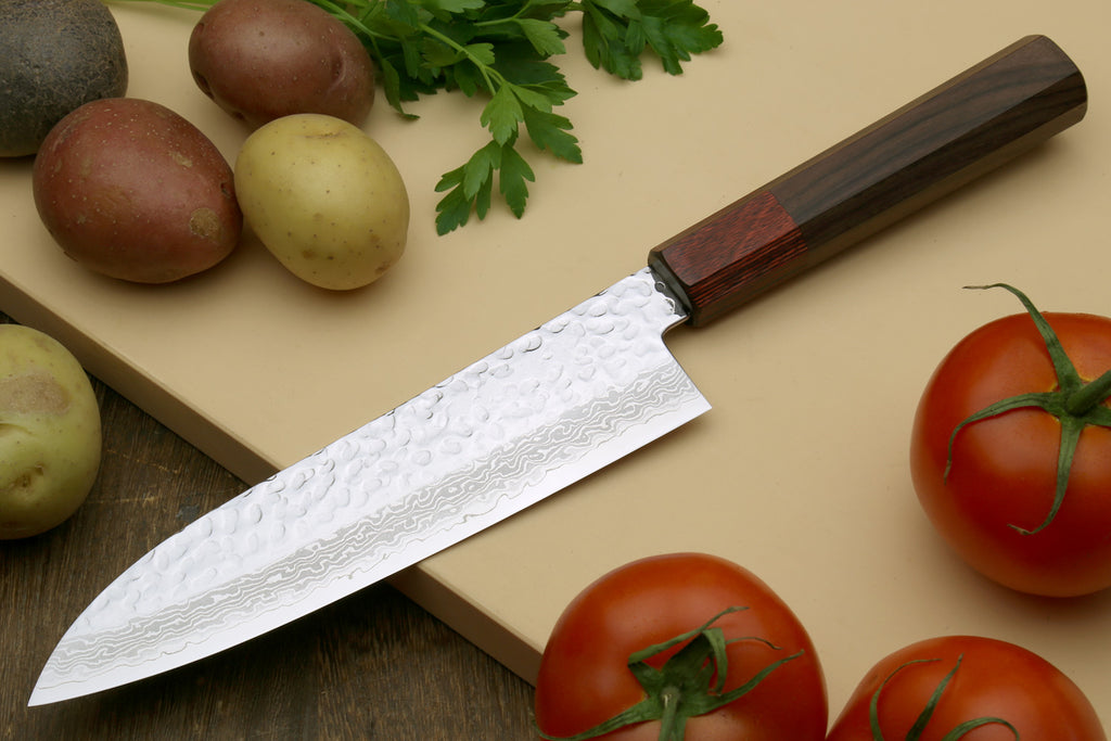 Damascus petty knife with rosewood handle and hammered blade pattern