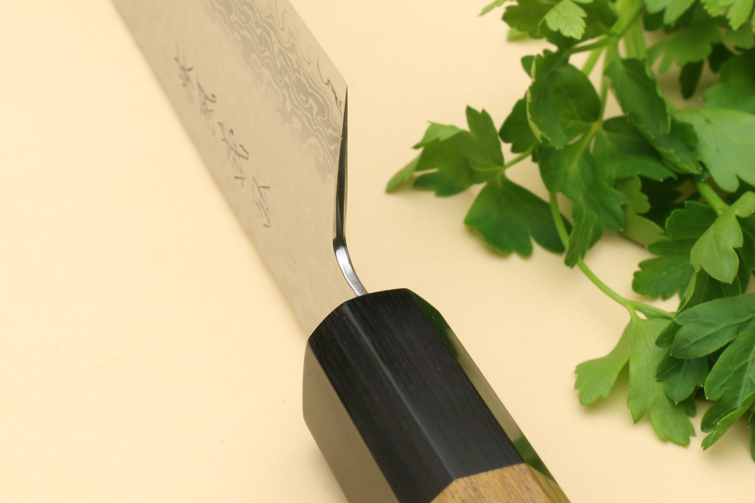 Santoku chef knife with hammered Damascus blade and octagonal wooden handle