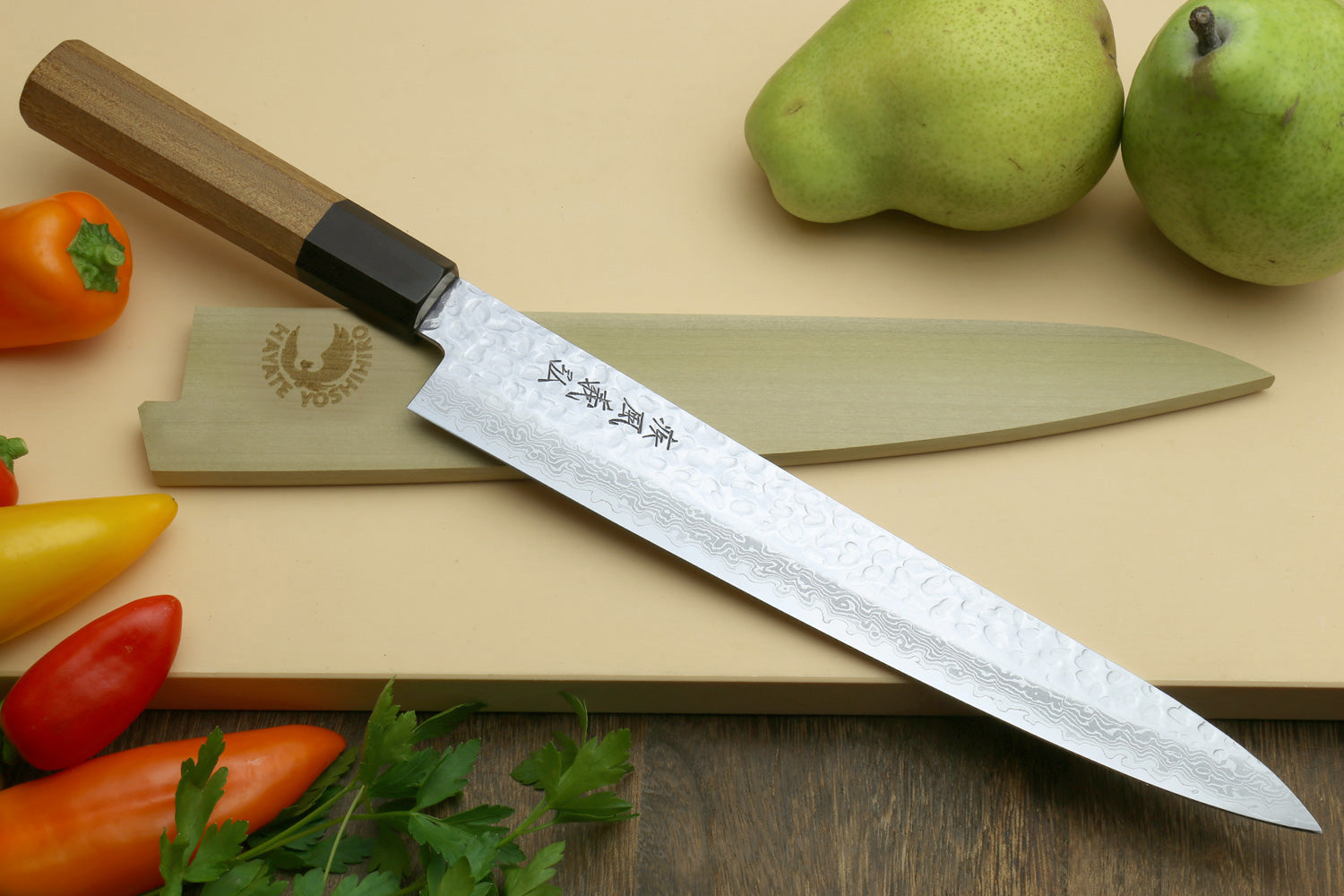 Japanese sujihiki slicer knife with hammered Damascus blade and octagonal wood handle