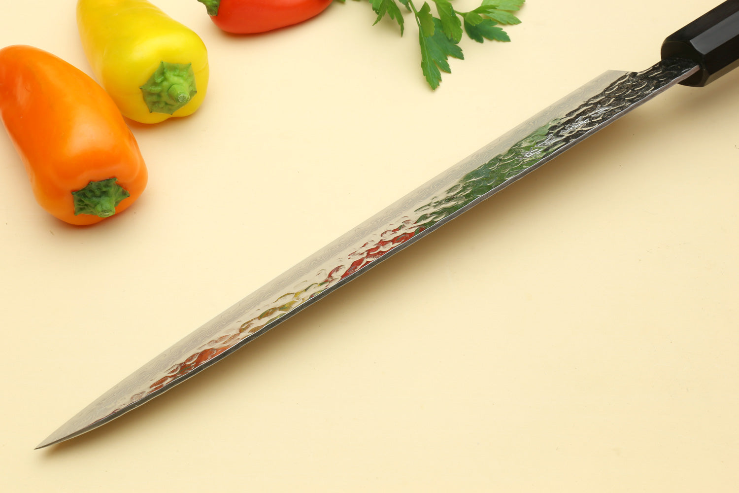 Sujihiki slicer knife with patterned Damascus blade and octagonal wooden handle