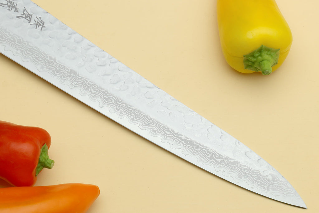 Japanese sujihiki slicer knife, hammered Damascus blade with pointed tip and rosewood handle