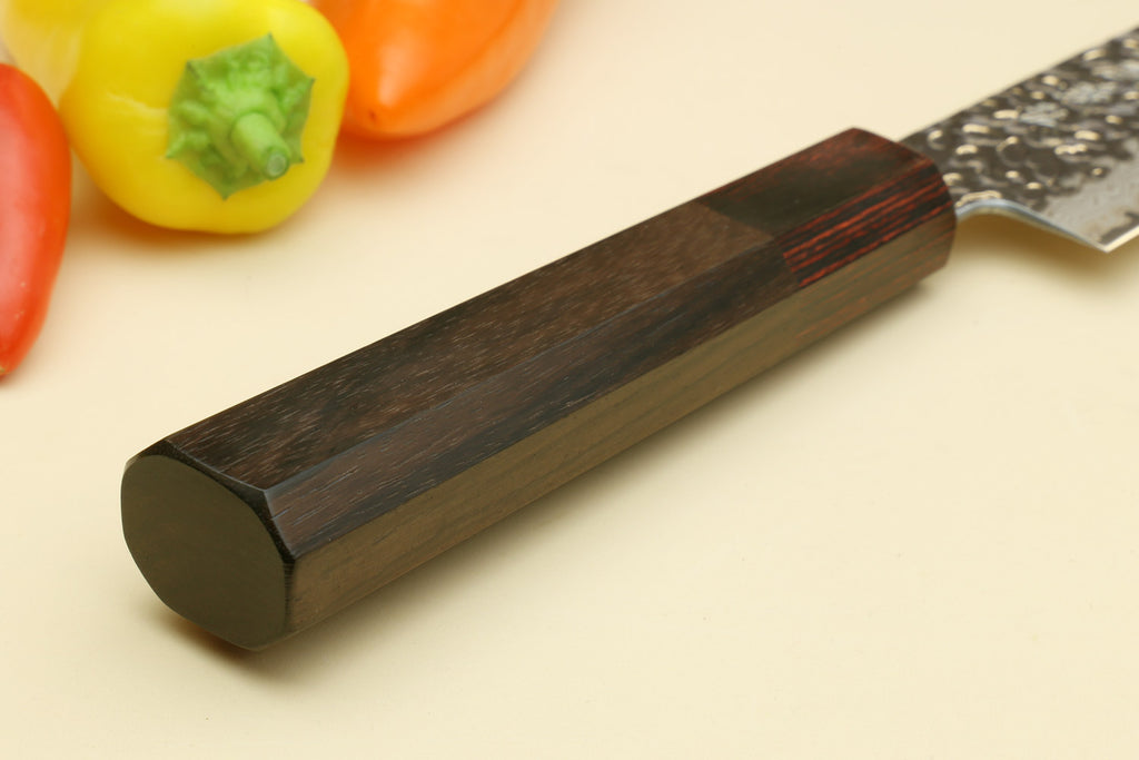Rosewood octagonal knife handle end with hammered Damascus blade close-up