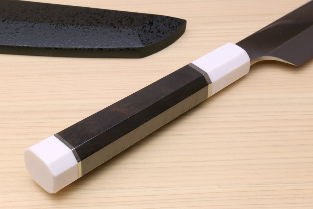 Japanese sushi sashimi knife with ebony handle, white bolster, and dark blade