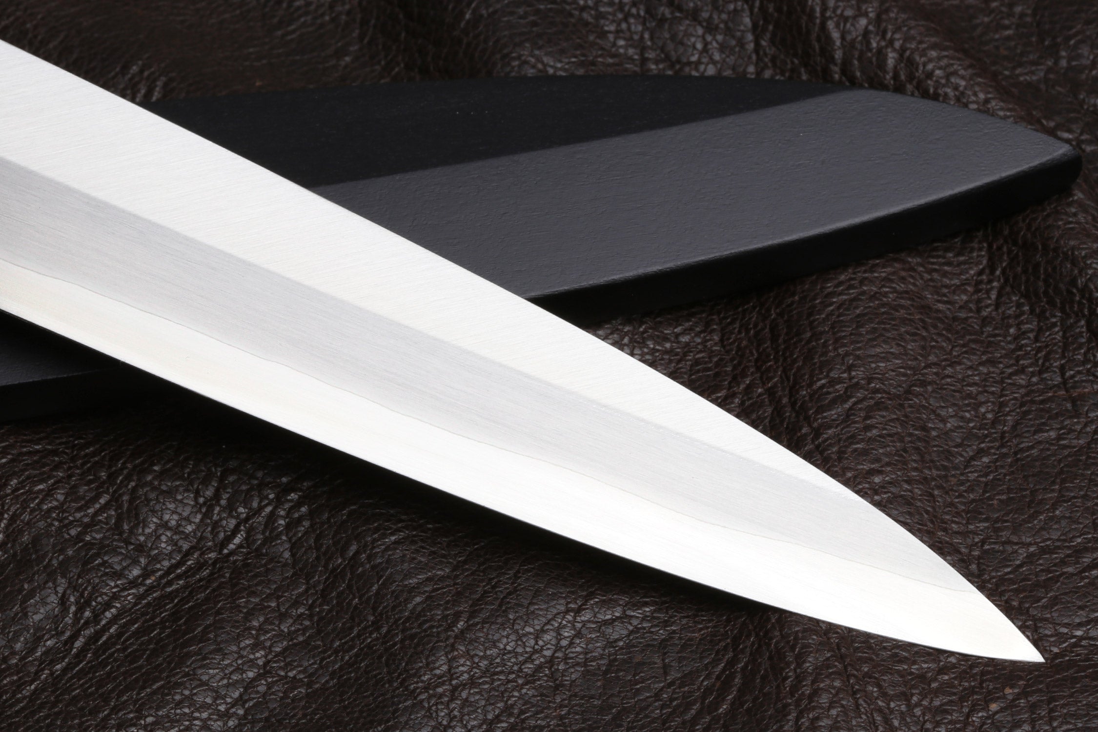 Yanagi sushi knife blade close-up with stainless steel edge