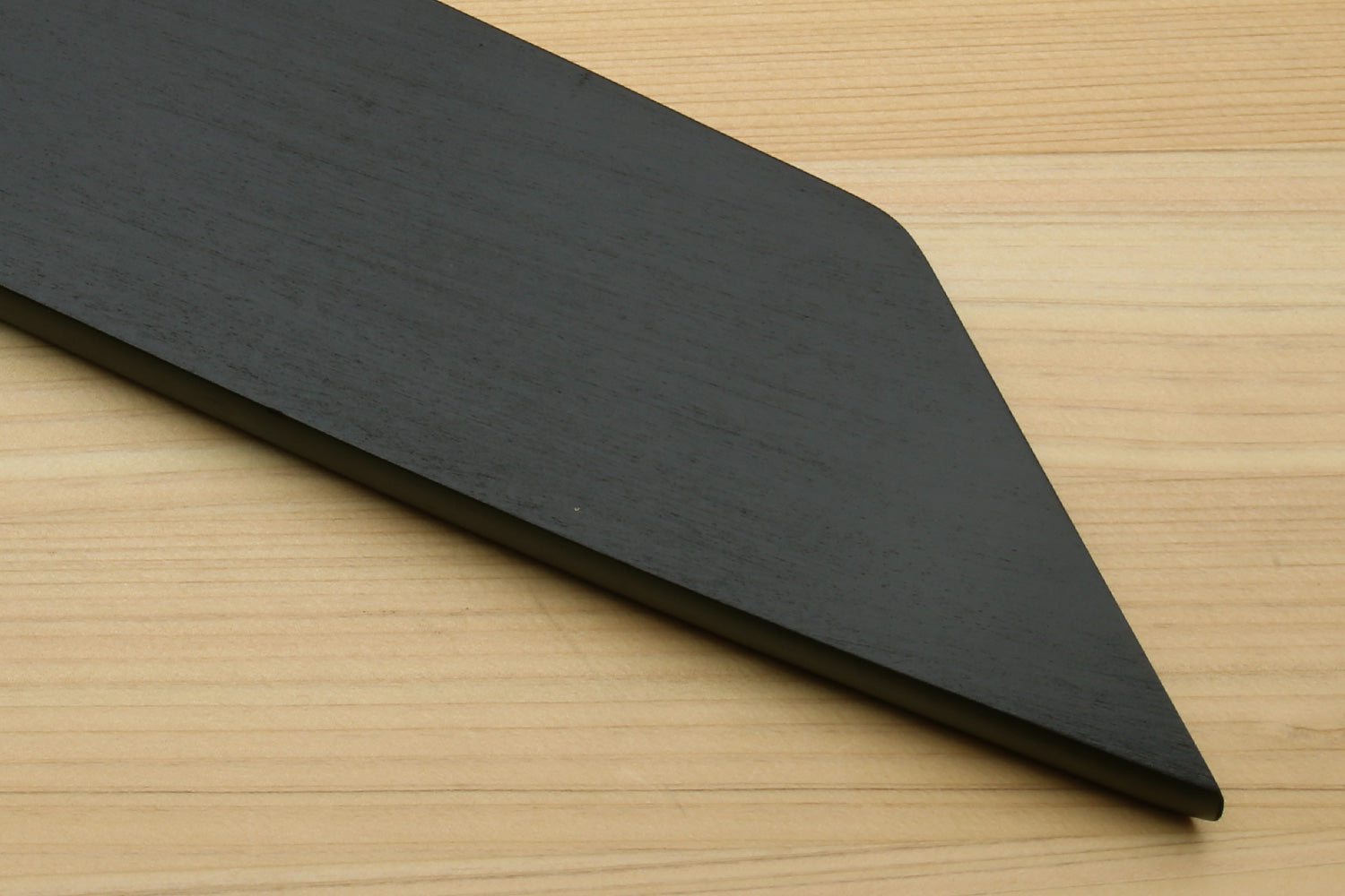 Lacquered wooden saya cover with smooth dark finish and tapered blade tip