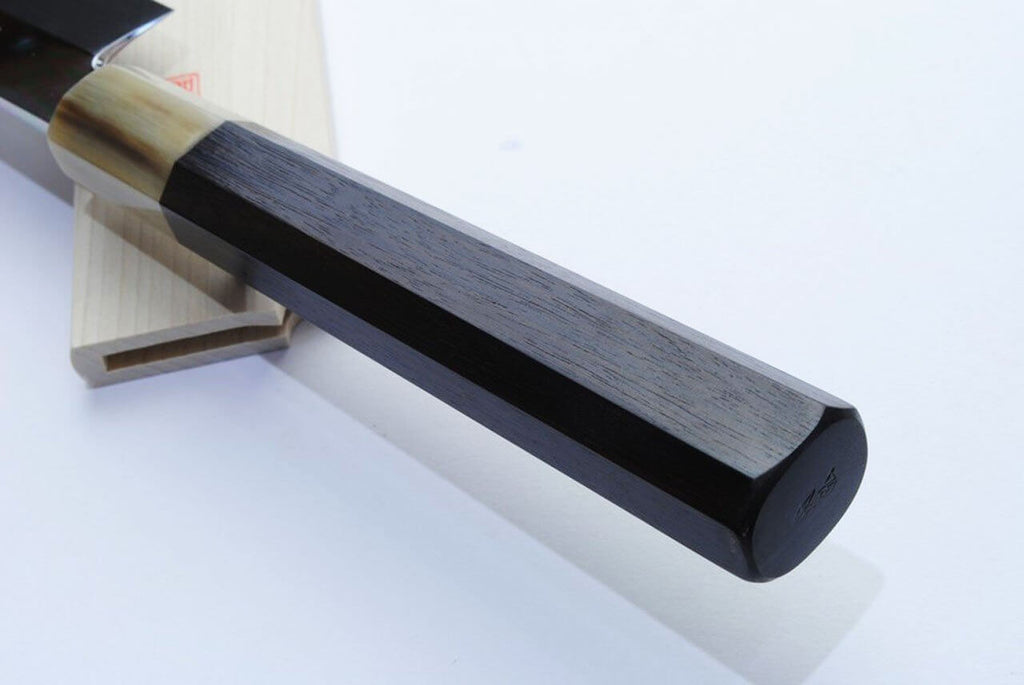 Wood saya with black end cap and dark blade edge; kiritsuke handle visible