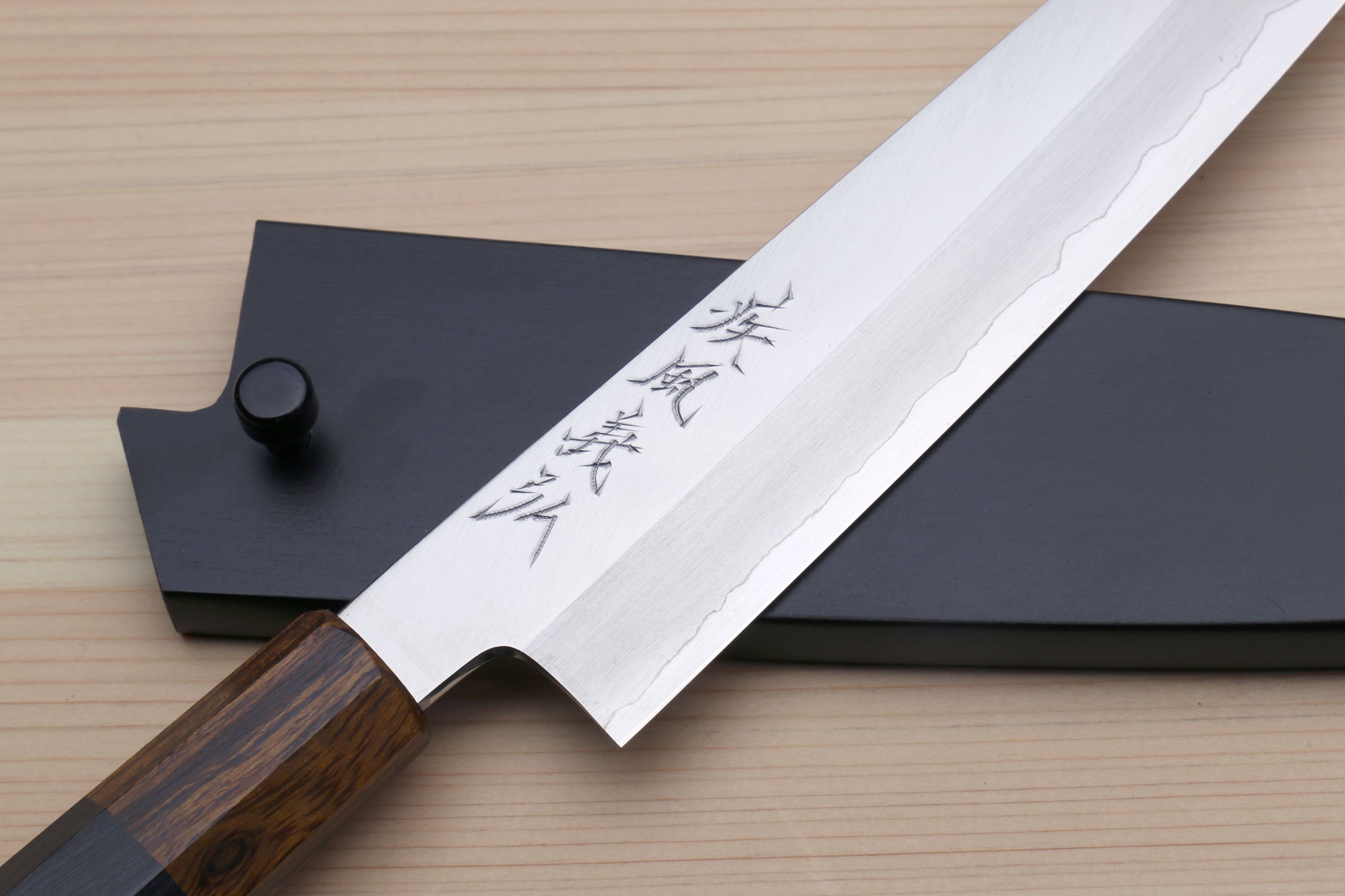 Petty utility knife with stainless blade and engraved kanji, in dark saya cover