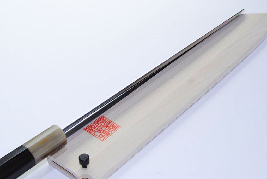 Kiritsuke sushi knife with long mirror-finished blade and light wood handle