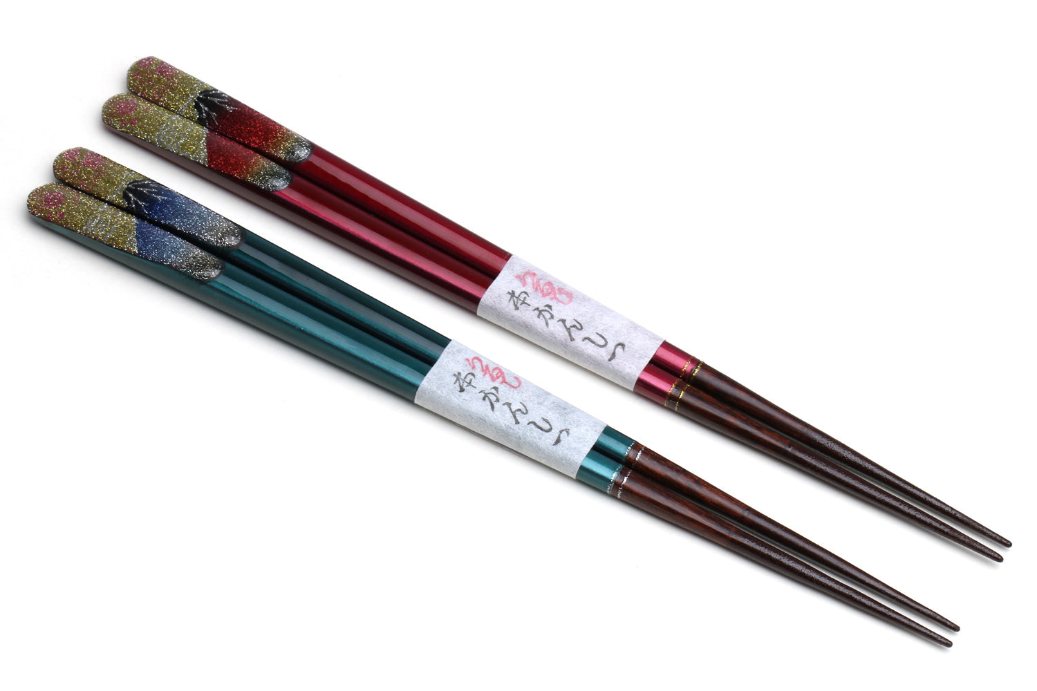 Four glitter lacquer chopsticks with red, teal, and multicolor bands