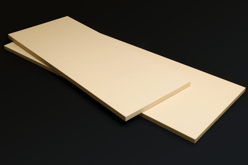 Cream Japanese cutting board with raised center seam and beveled edges.