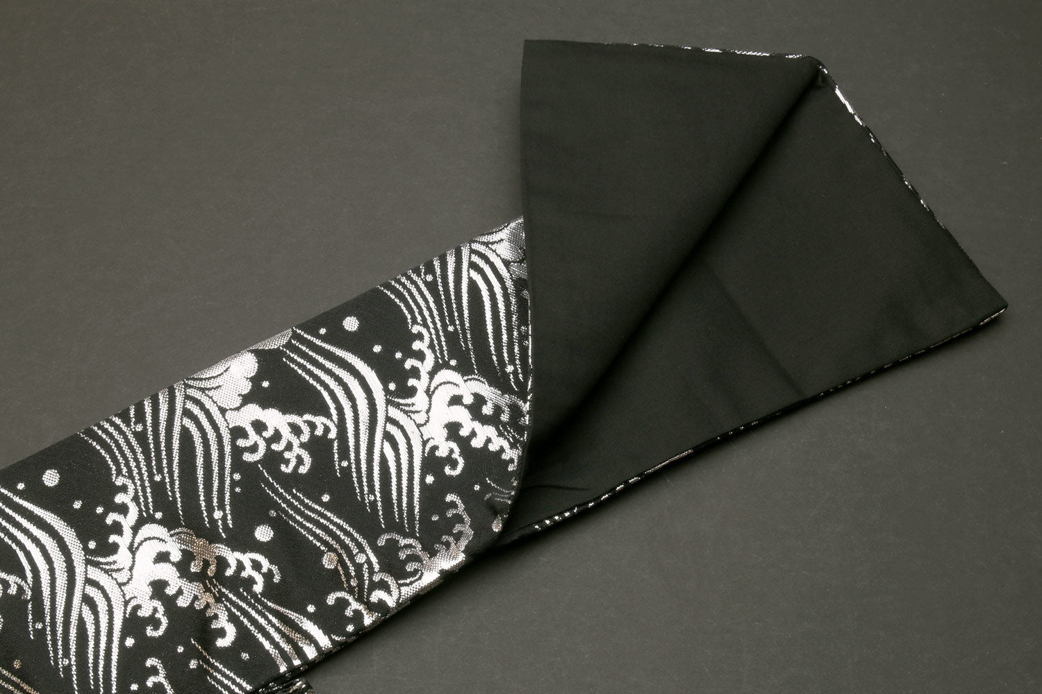 Knife pouch bag open view with black lining and black-and-white wave patterned outer flap