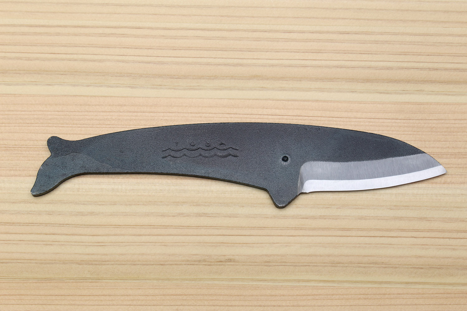 Utility knife with dark kurouchi finish, whale pattern, and straight silver blade