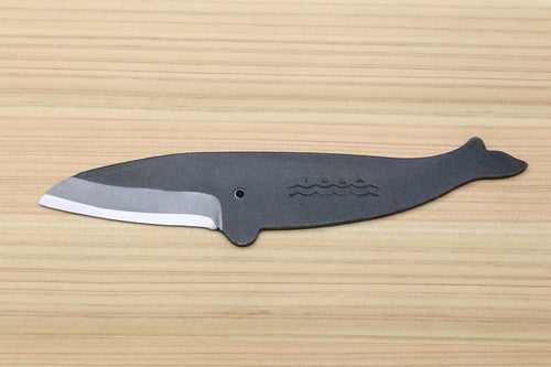 Japanese utility knife with dark blade and wave engraving, silver edge visible
