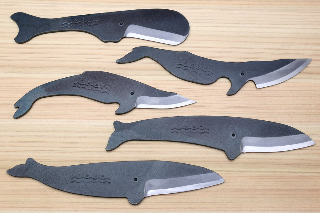 Five-piece utility knife set with dark kurouchi finish, whale pattern, and silver blades