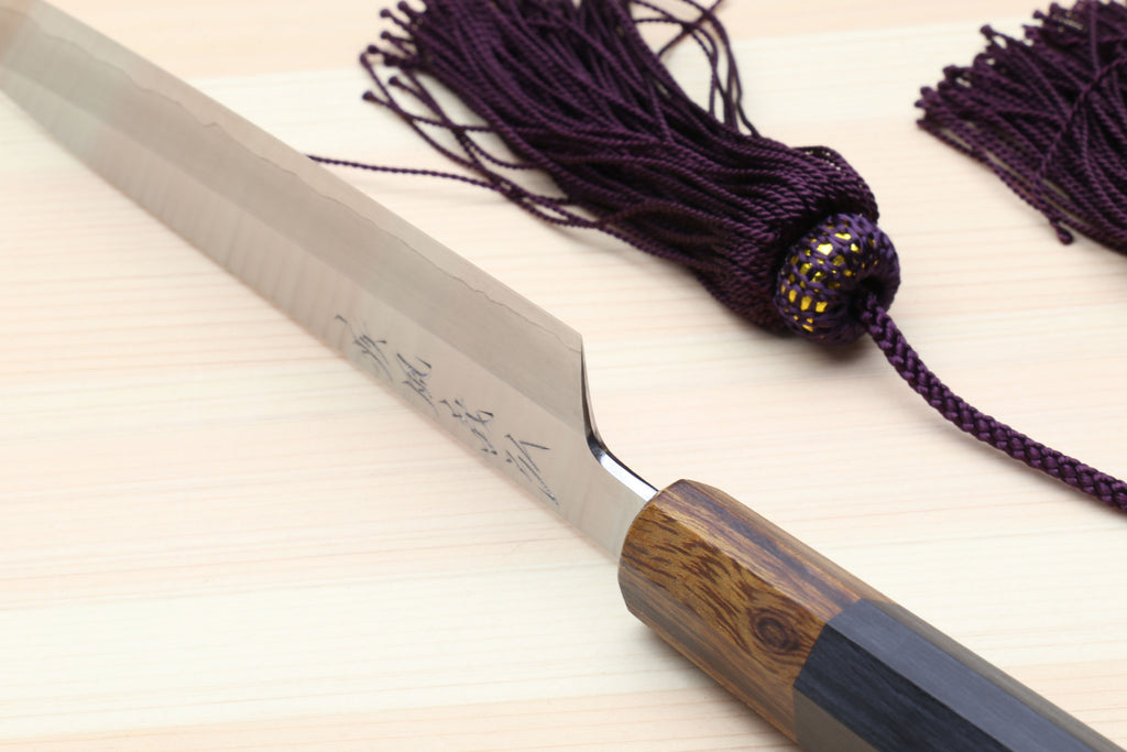 Petty utility knife with stainless blade, dark ebony handle, and purple tassel cord