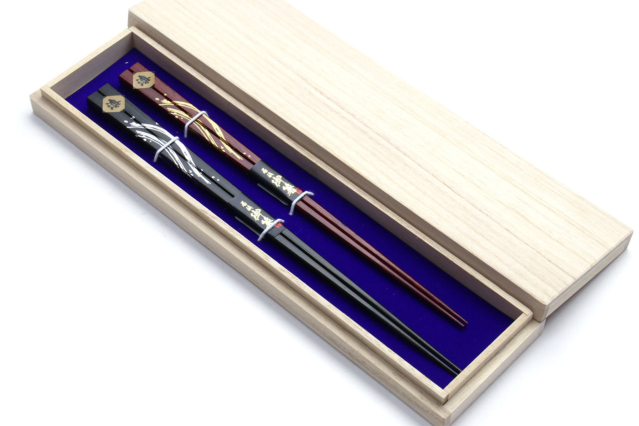 Chopsticks set in light wooden box with blue insert lining