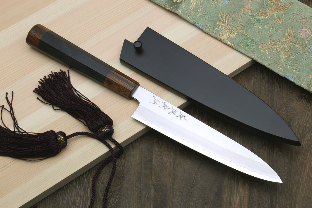 Petty utility knife with dark ebony handle, stainless blade, and dark saya cover