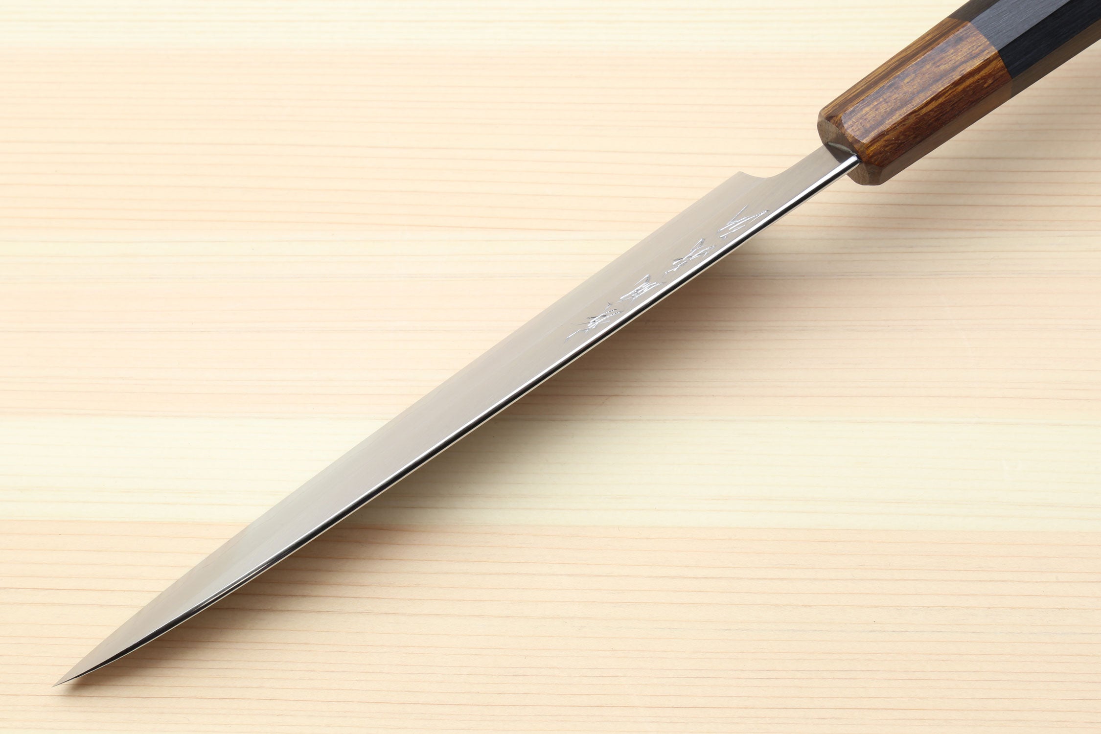 Petty utility knife with pointed stainless blade and dark ebony handle