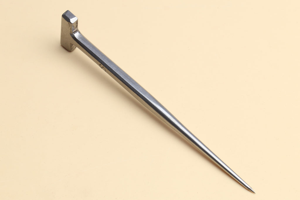 Metal eel spike tool with a T-shaped head and long pointed end