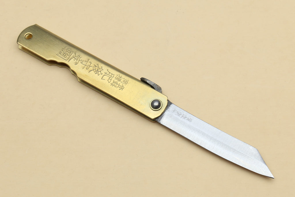 Kiridashi pocket knife with gold handle, rivet detail, and stainless pointed blade