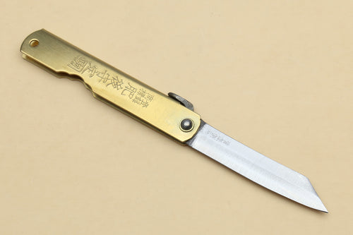 Kiridashi pocket knife with gold handle, rivet detail, and stainless pointed blade