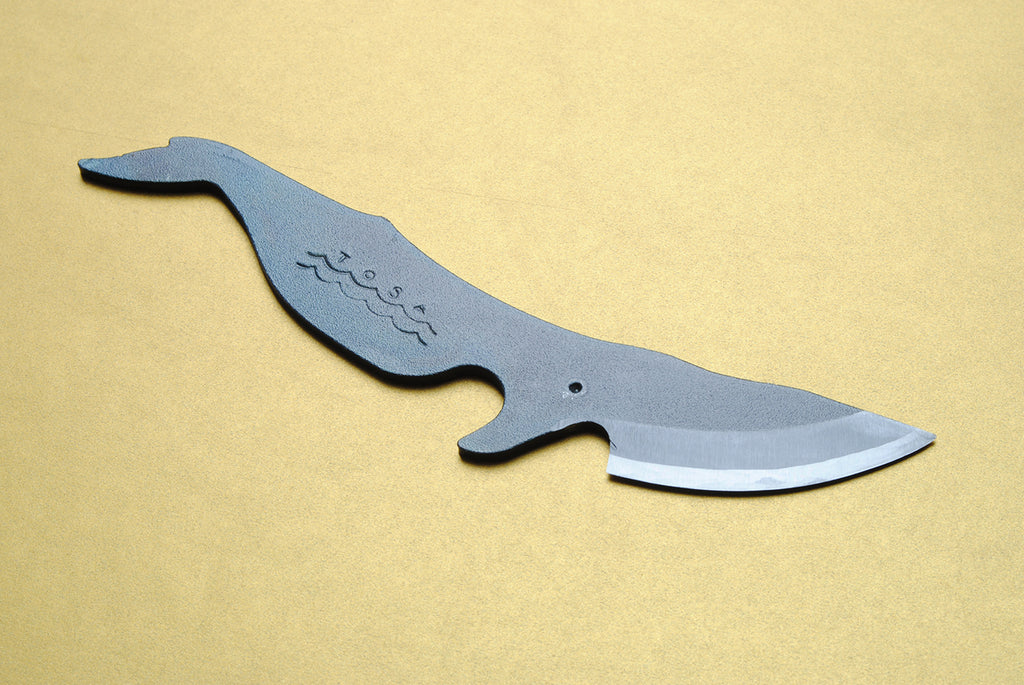 Whale-shaped utility knife with dark blue-gray handle and stainless steel blade