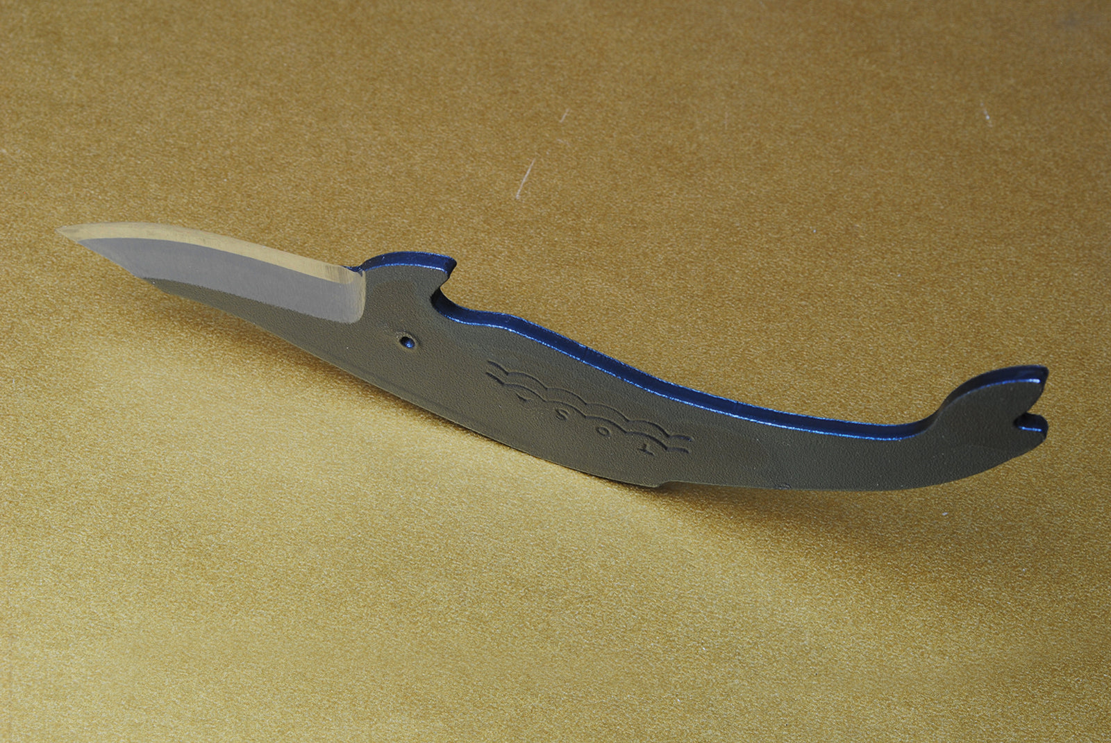 Whale utility knife with wave etching, dark steel finish, and short curved silver blade