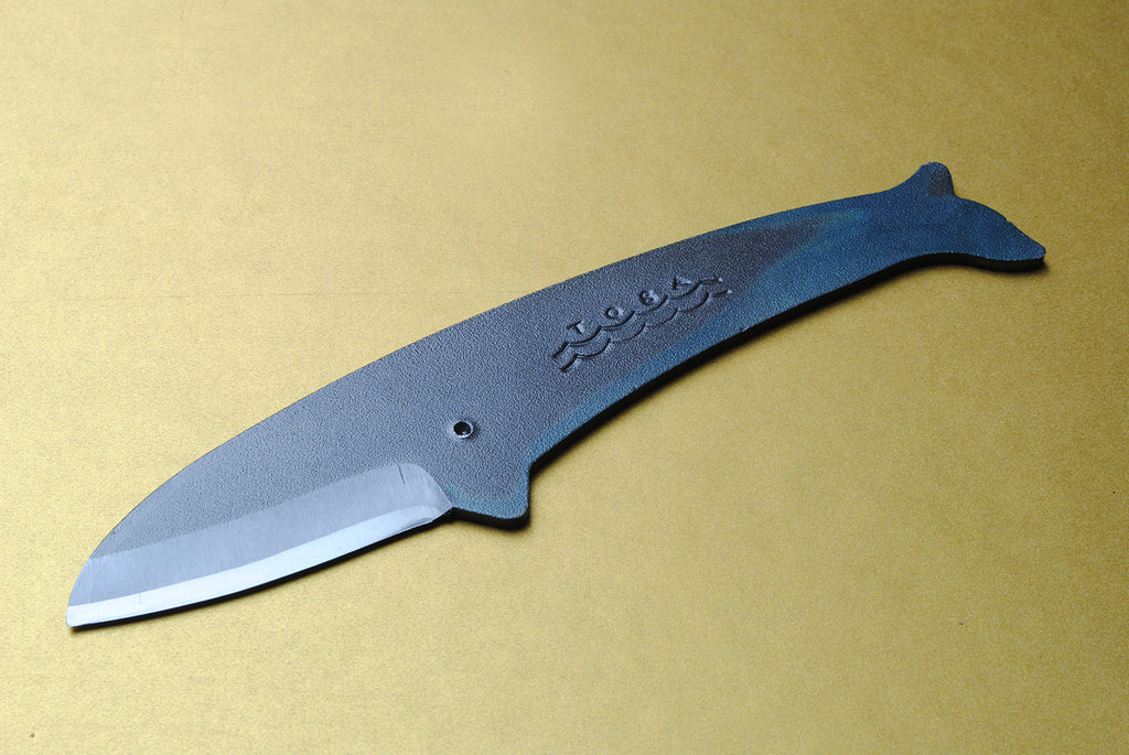 Whale utility knife with dark blue handle and silver blade, pointed tip