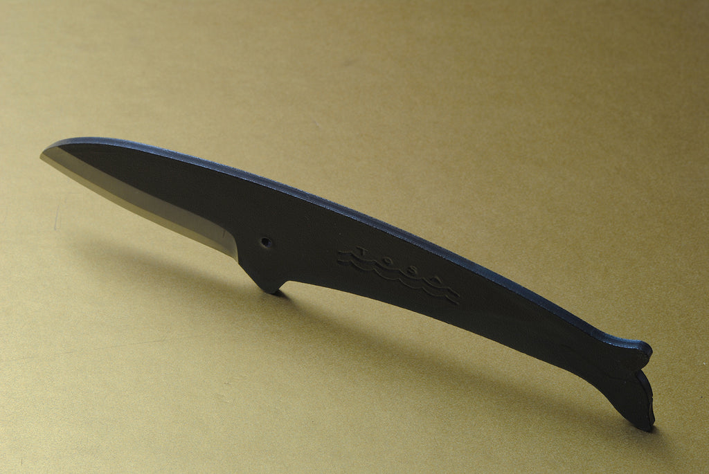 Whale utility knife with dark finish, silver edge, wavy emblem on handle