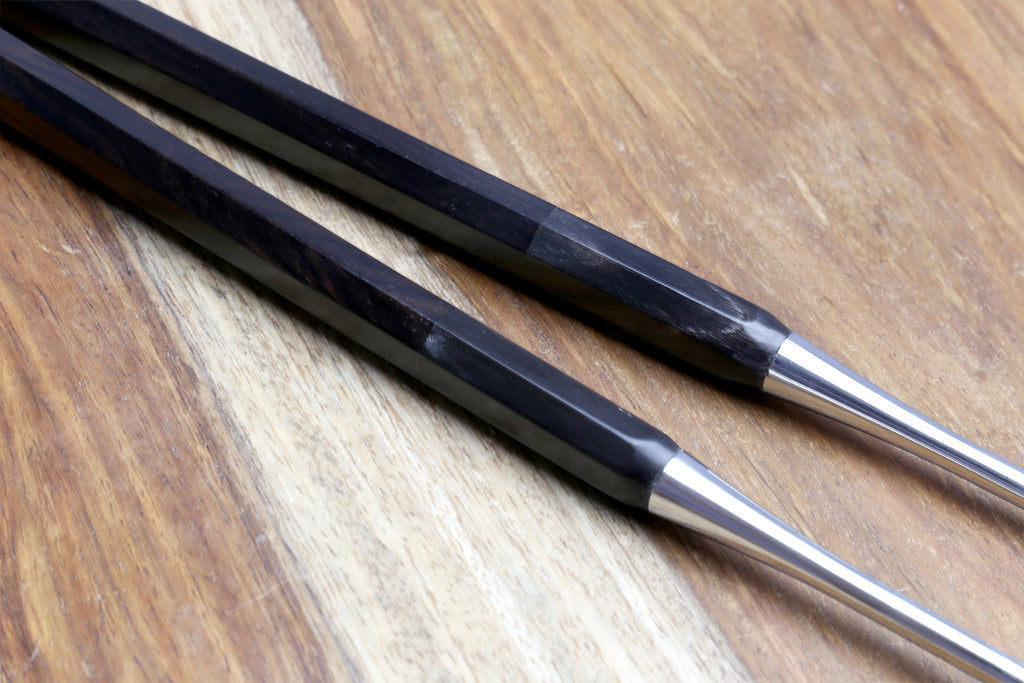 Plating tweezers with ebony octagonal handles and polished metal tips, side-by-side