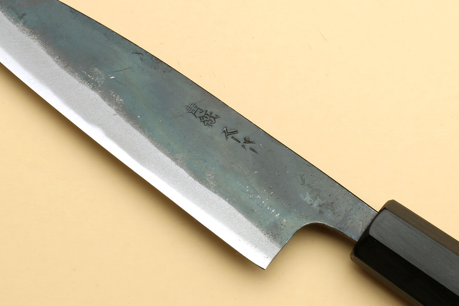 Petty utility knife blade with engraved text and dark shitan wood handle