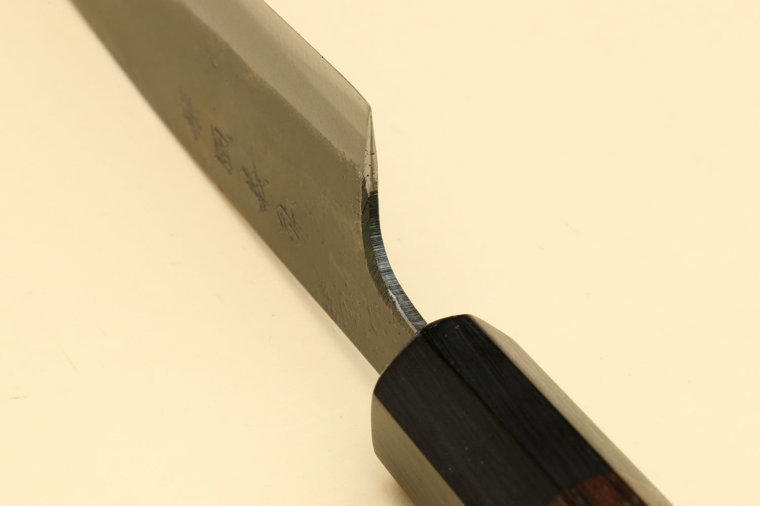 Petty utility knife close-up of blade edge and dark shitan wood handle