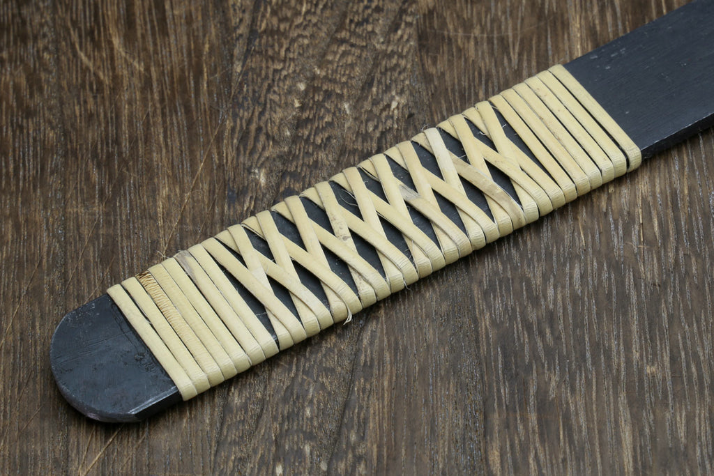 Kiridashi utility knife handle detail with light ribbed wood scales and dark end cap