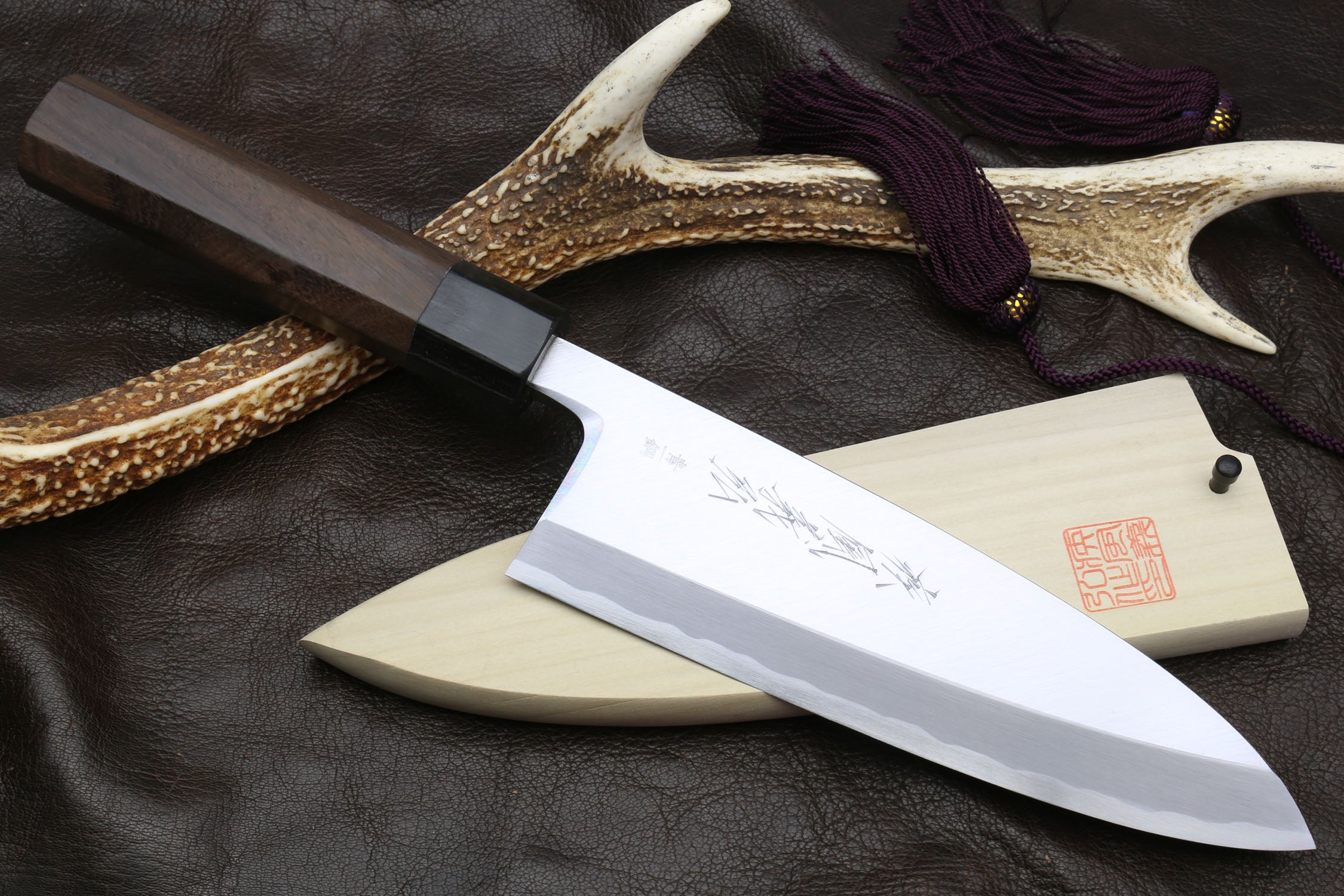 Japanese deba fillet knife with stainless blue steel blade and dark shitan handle