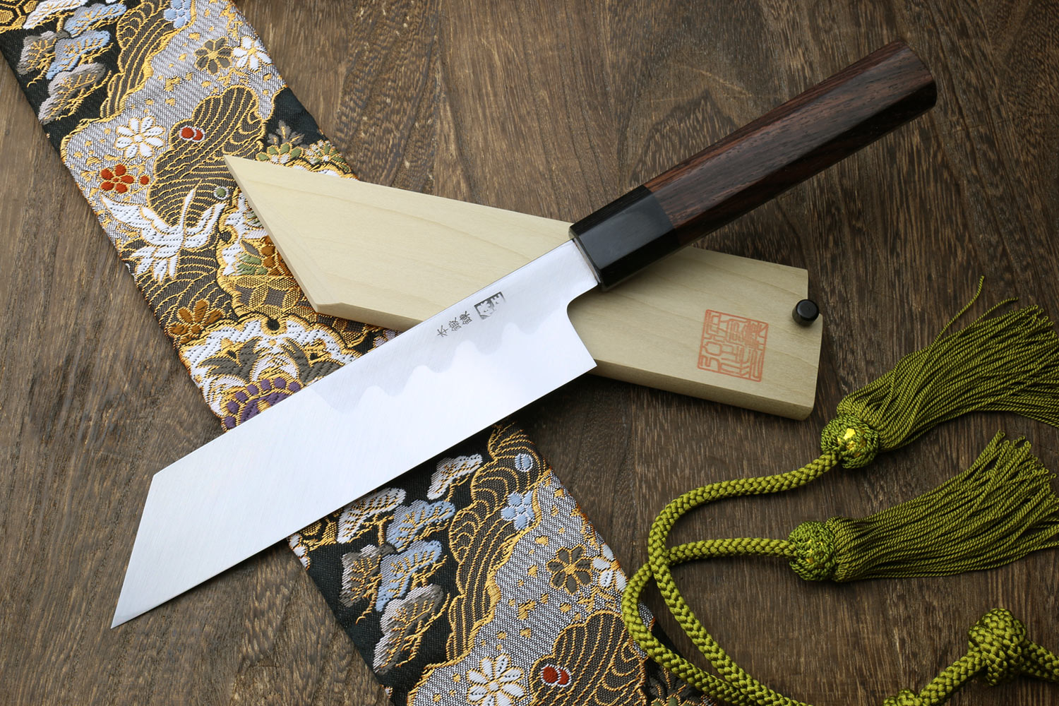 Japanese single-edged vegetable knife with dark wood handle and wooden saya cover