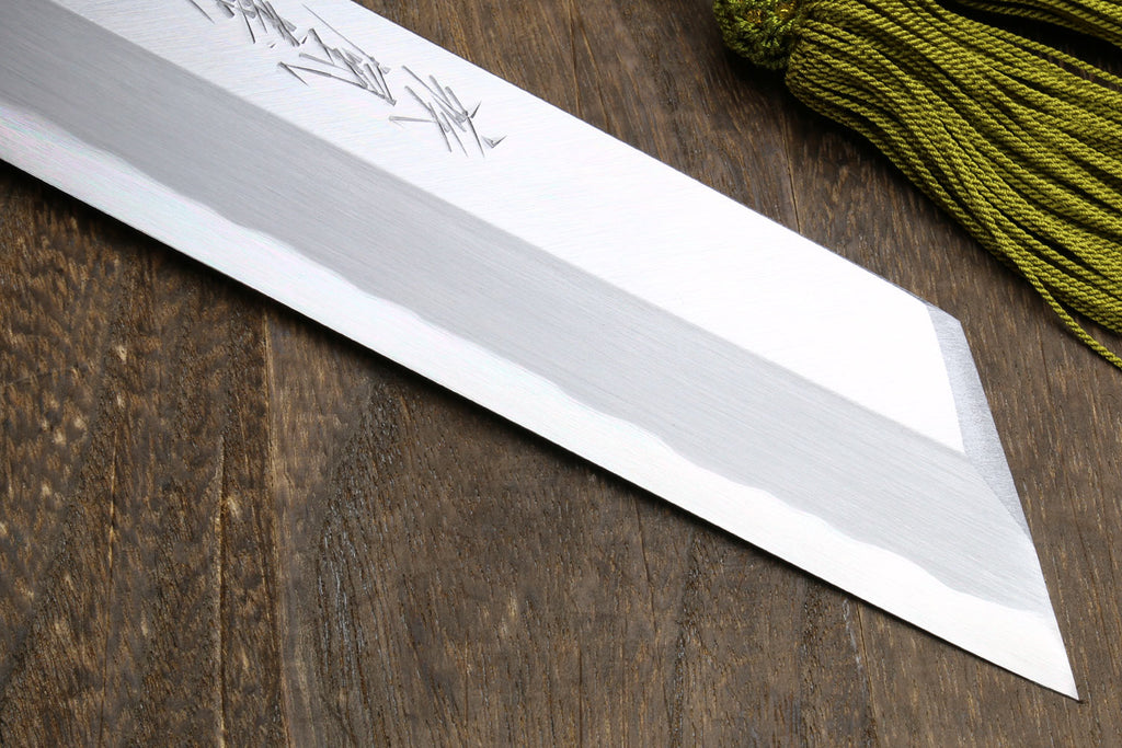 Japanese single-edged vegetable knife, close-up of silver blade edge and flat grind