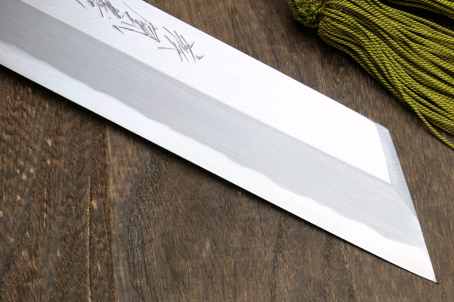 Japanese single-edged vegetable knife, close-up of silver blade edge and flat grind