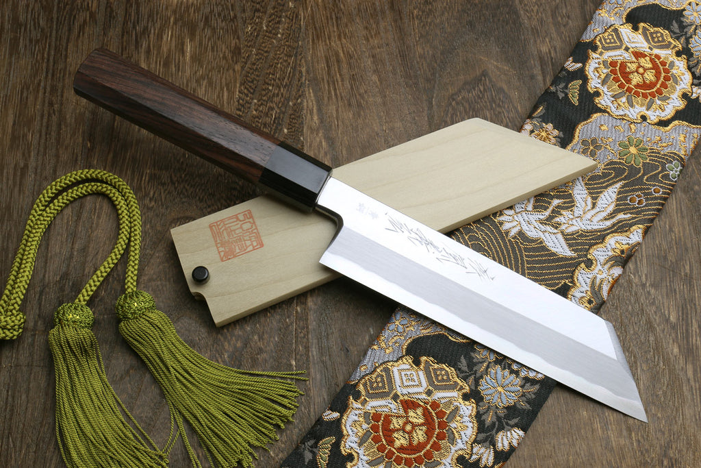 Japanese single-edged vegetable knife with wooden saya, dark handle, green cords, and wrap cloth