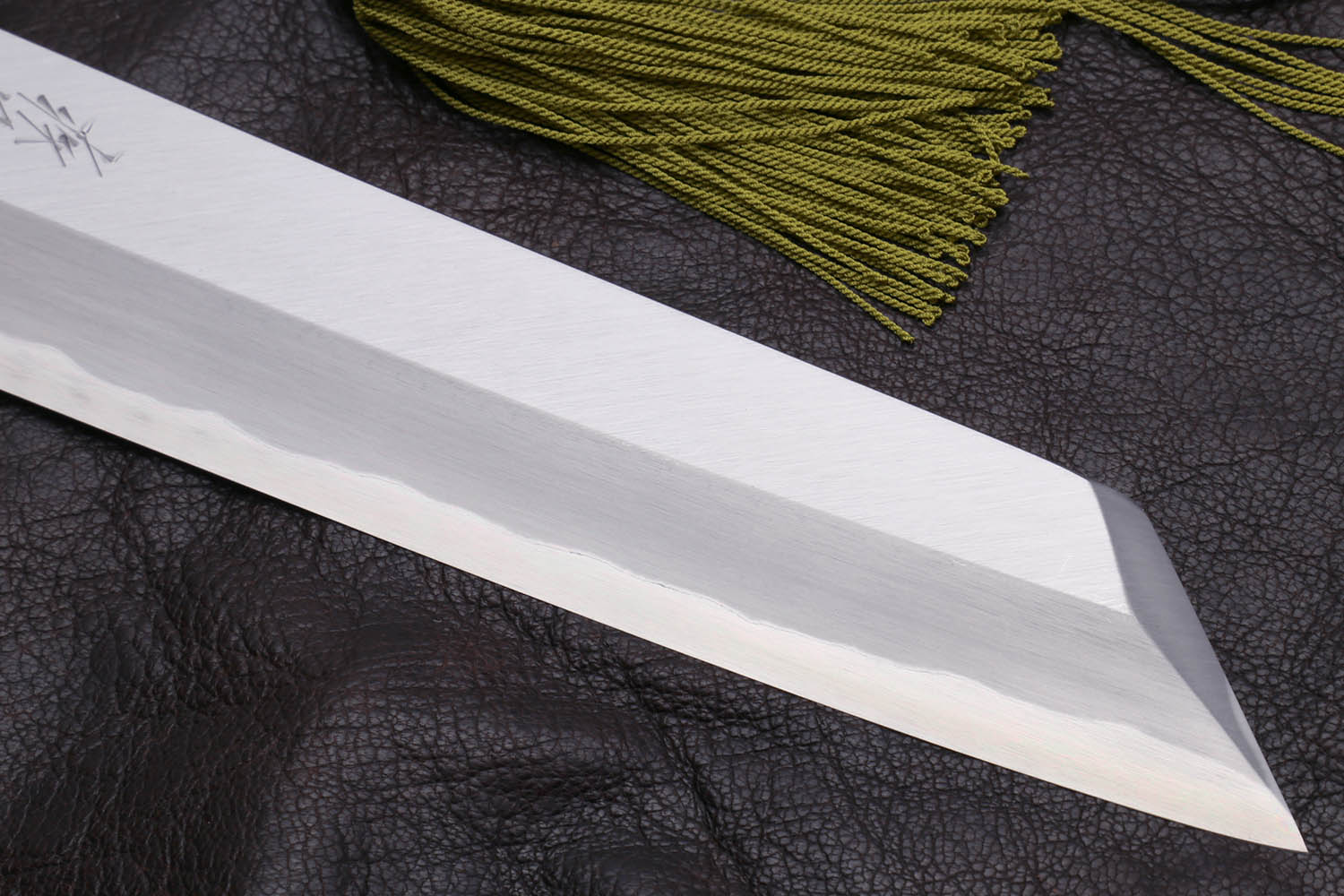 Multipurpose chef knife blade edge close-up on silver steel