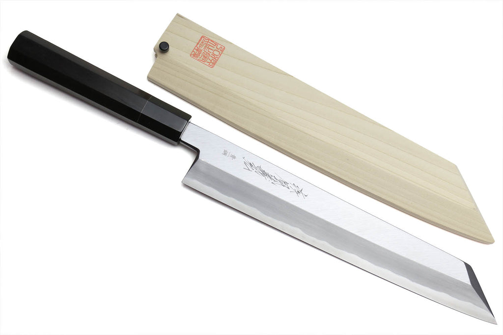 Multipurpose chef knife with silver blade and black handle, light wood sheath