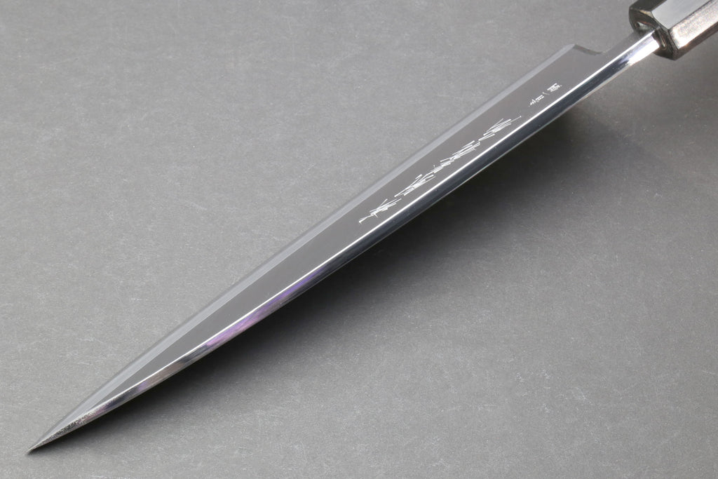 Japanese chef knife side profile with polished steel blade
