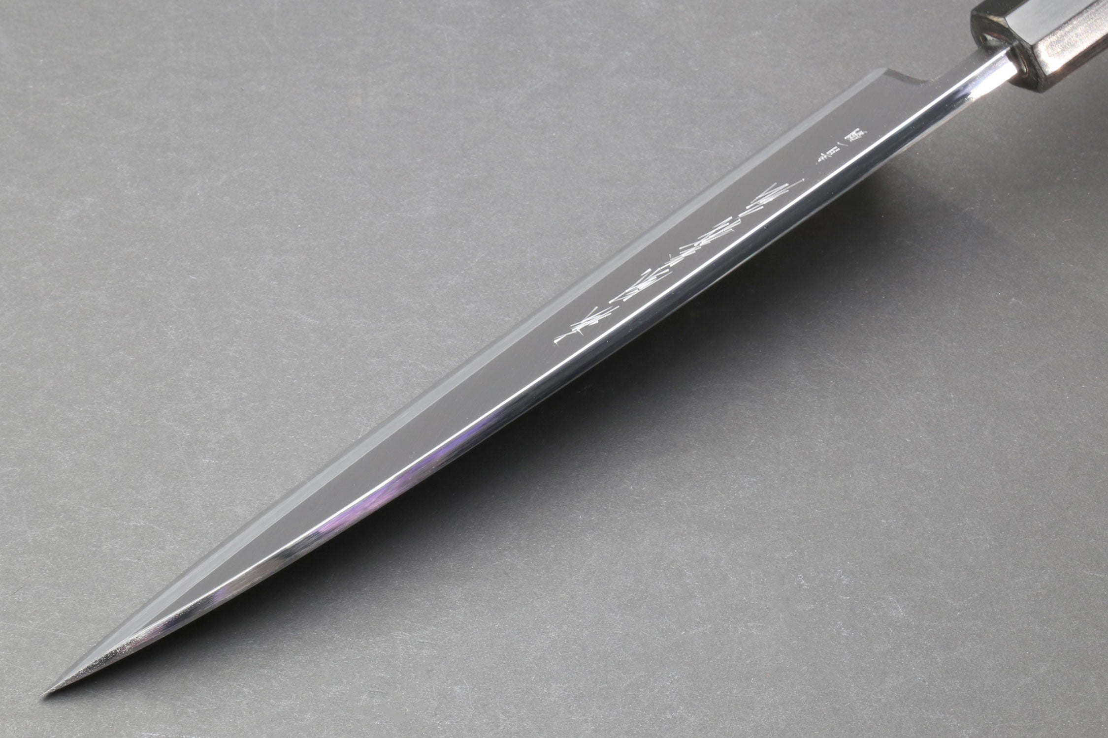 Japanese chef knife side profile with polished steel blade