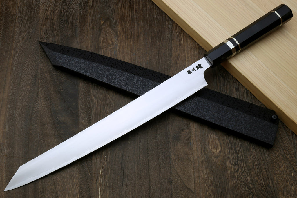 Kiritsuke slicer knife with white blade, dark ebony handle, and triple nickel rings