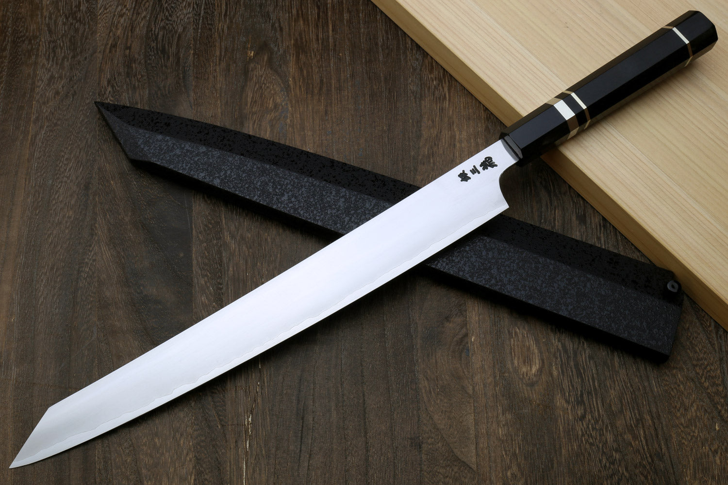 Kiritsuke slicer knife with white blade, dark ebony handle, and triple nickel rings