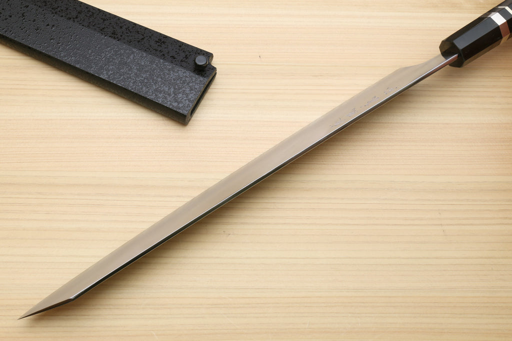 Kiritsuke slicer knife side view with white blade and dark ebony handle