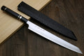Kiritsuke slicer knife with white blade, dark ebony handle, and black sheath